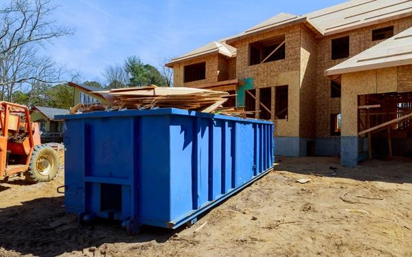 construction dumpsters can hold a variety of materials, including debris from demolition projects, roofing materials, lumber, and concrete